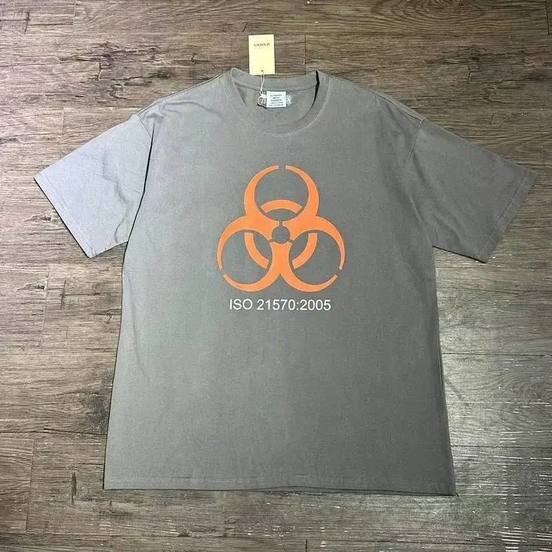 VETEMENTS Gray T-Shirt with Orange Biohazard & ISO 21570:2005