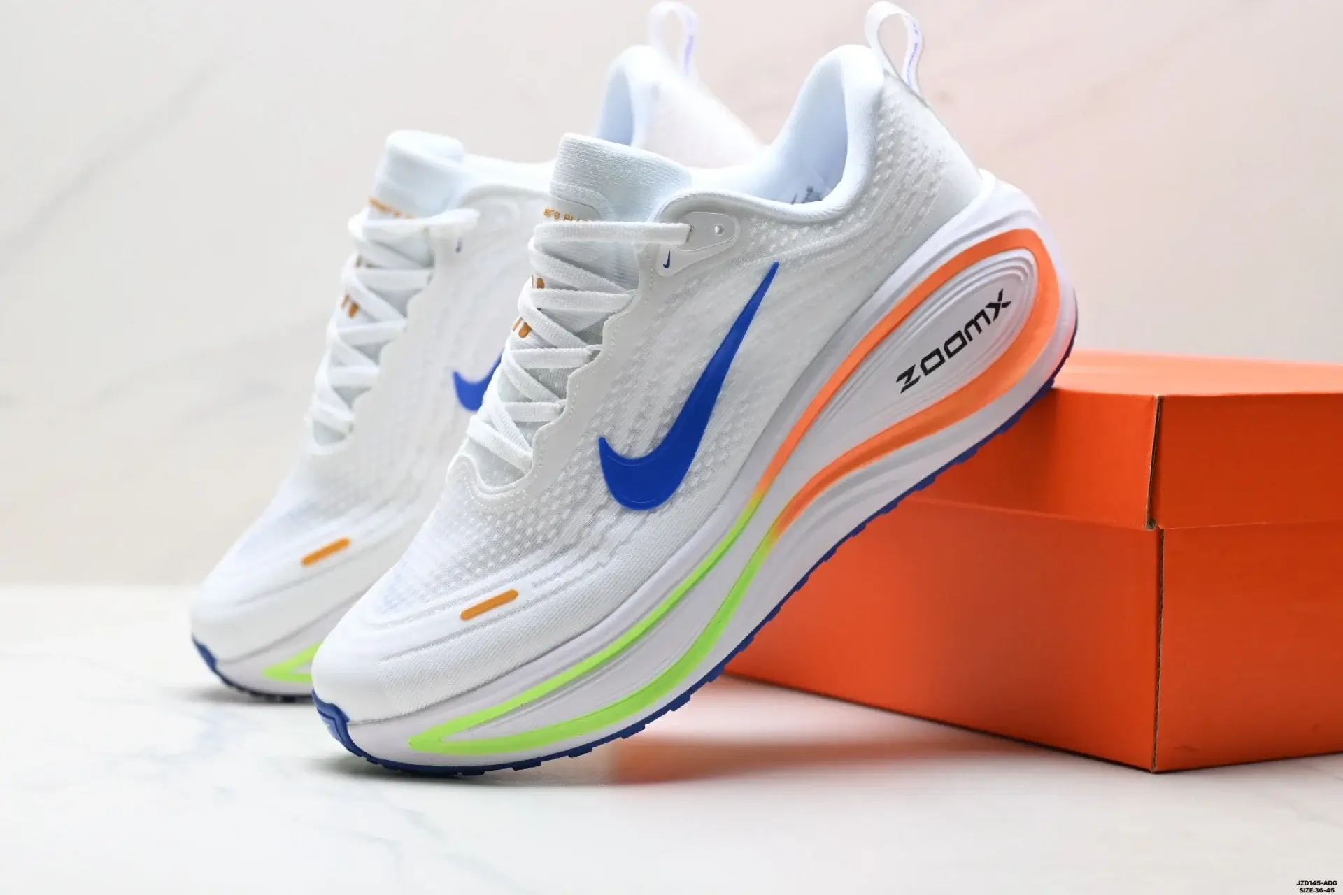 Nike ZoomX Running Shoes: Blue Swoosh, Orange & Green