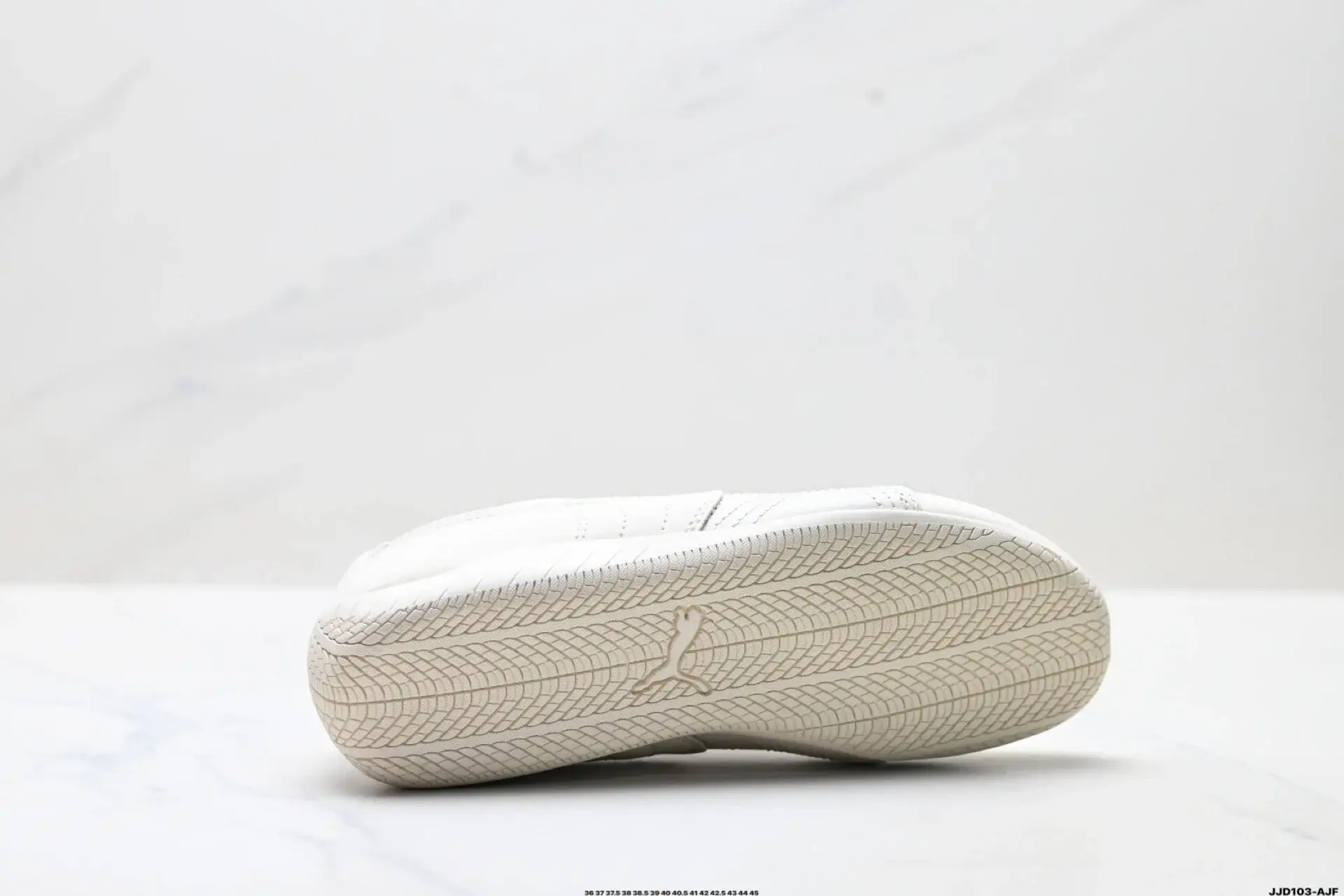 Puma White Sneakers: Textured Sole & Logo