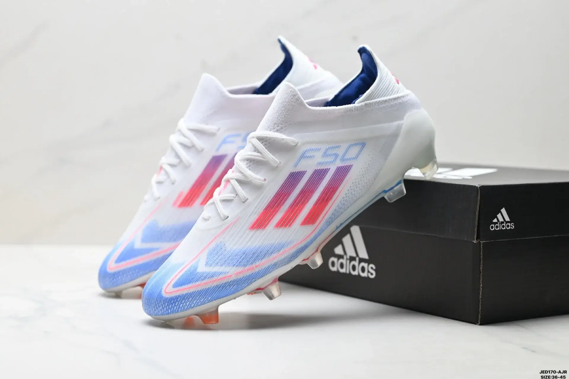 Adidas F50 Cleats: White, Blue & Pink Gradient