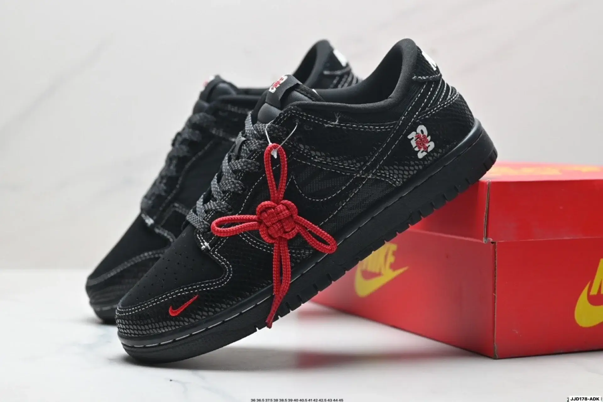 Nike Snake Pattern Black Sneakers with Red Knot Laces