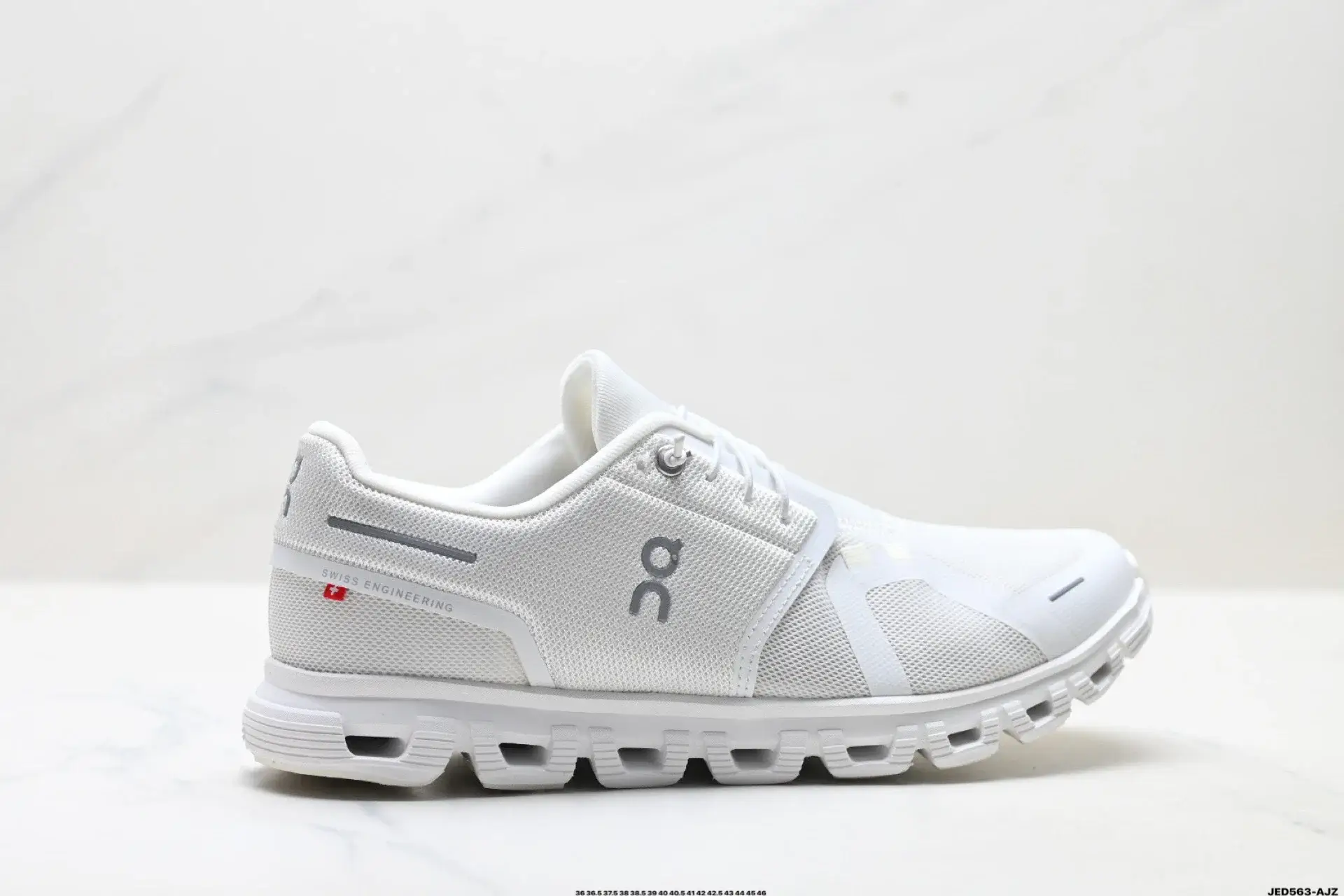 On White Mesh Athletic Shoes with Swiss Engineering & Cut-Out Sole