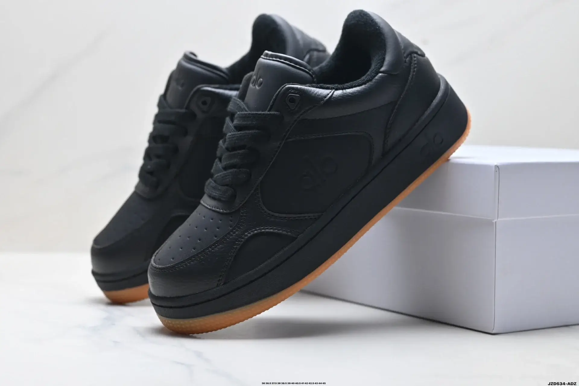 Alo Black Leather Low-Top Gum Sole Sneakers