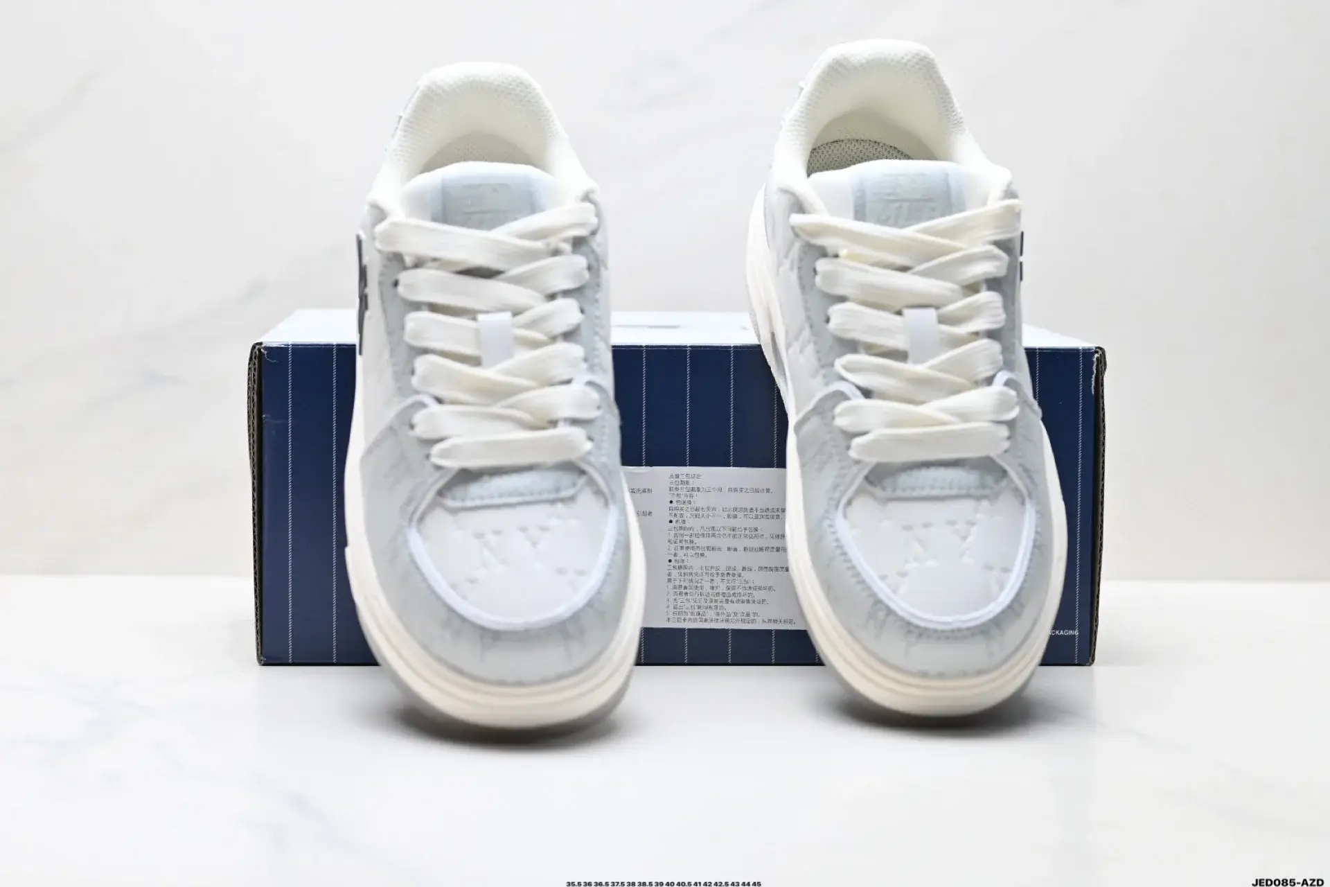 Louis Vuitton Embossed Light Gray & White Low-Top Sneakers