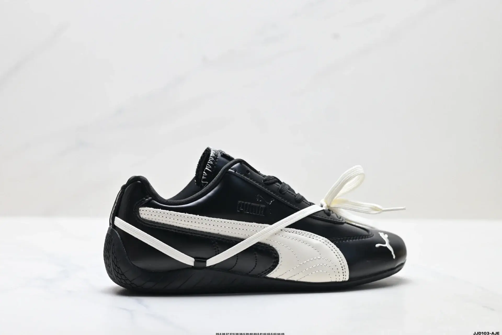 PUMA Black & White Sneakers