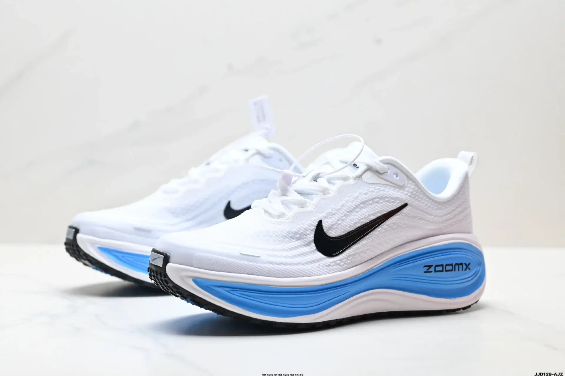 Nike White Running Shoes: ZoomX Midsole, Black Swoosh