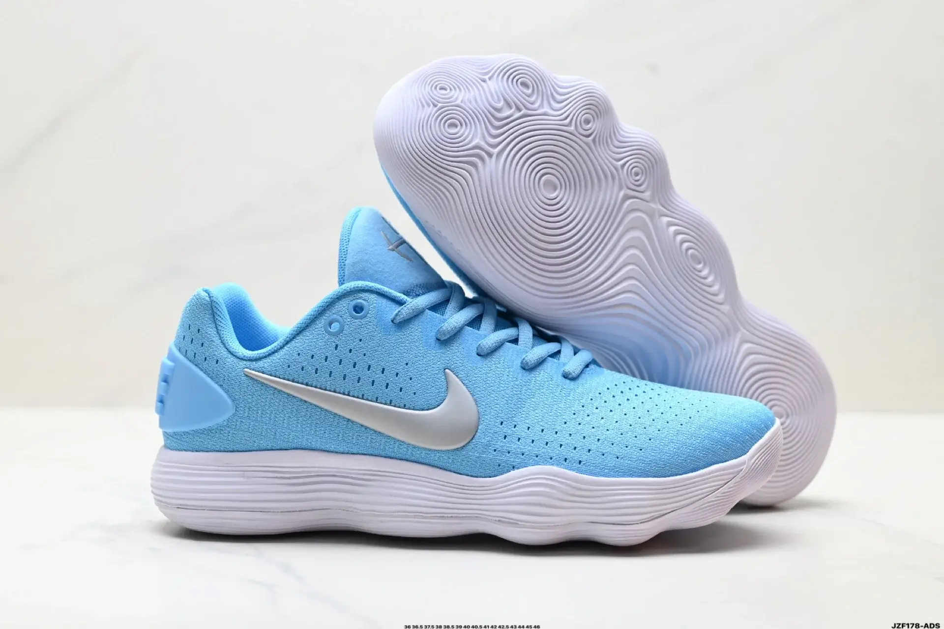 Nike Light Blue B-ball Shoes: Breathable Mesh & Patterned Outsole